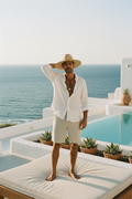 Man wearing light linen shorts on a coastal summer day